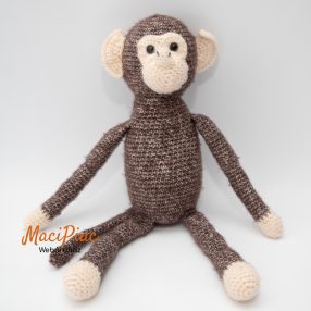 Barna kötött majom, maki zörögő van a testében