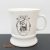 Vintage porcelán bögre, amelyen a híres osztrák édességgyártó, a Manner logója és egy bécsi látkép látható