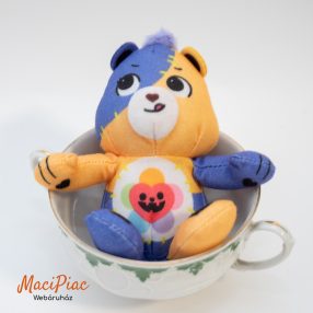   Mc donalds plüss figura, maci 2025 (lila-sárga) Gondos Bocsok (Care Bears) karakterek patchwork, azaz foltvarrás stílusú Halloweeni kiadás Harmony Bear (Harmónia bocs)
